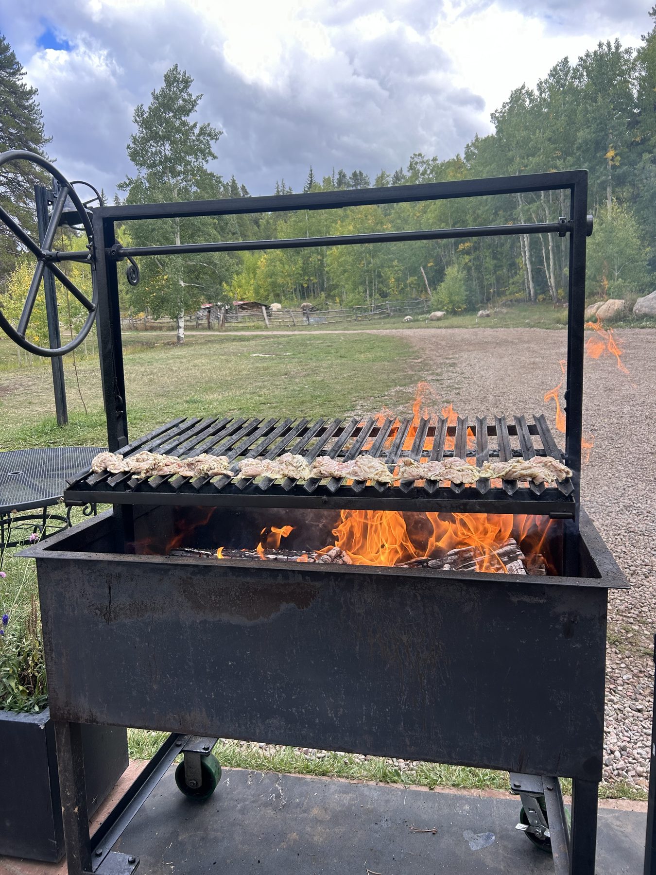 Open fire mountain grilling in Aspen, Colorado — traveling private chef Andrew Oliver