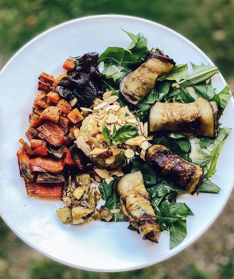 Roasted vegetable plate with eggplant rolls and toasted almonds
