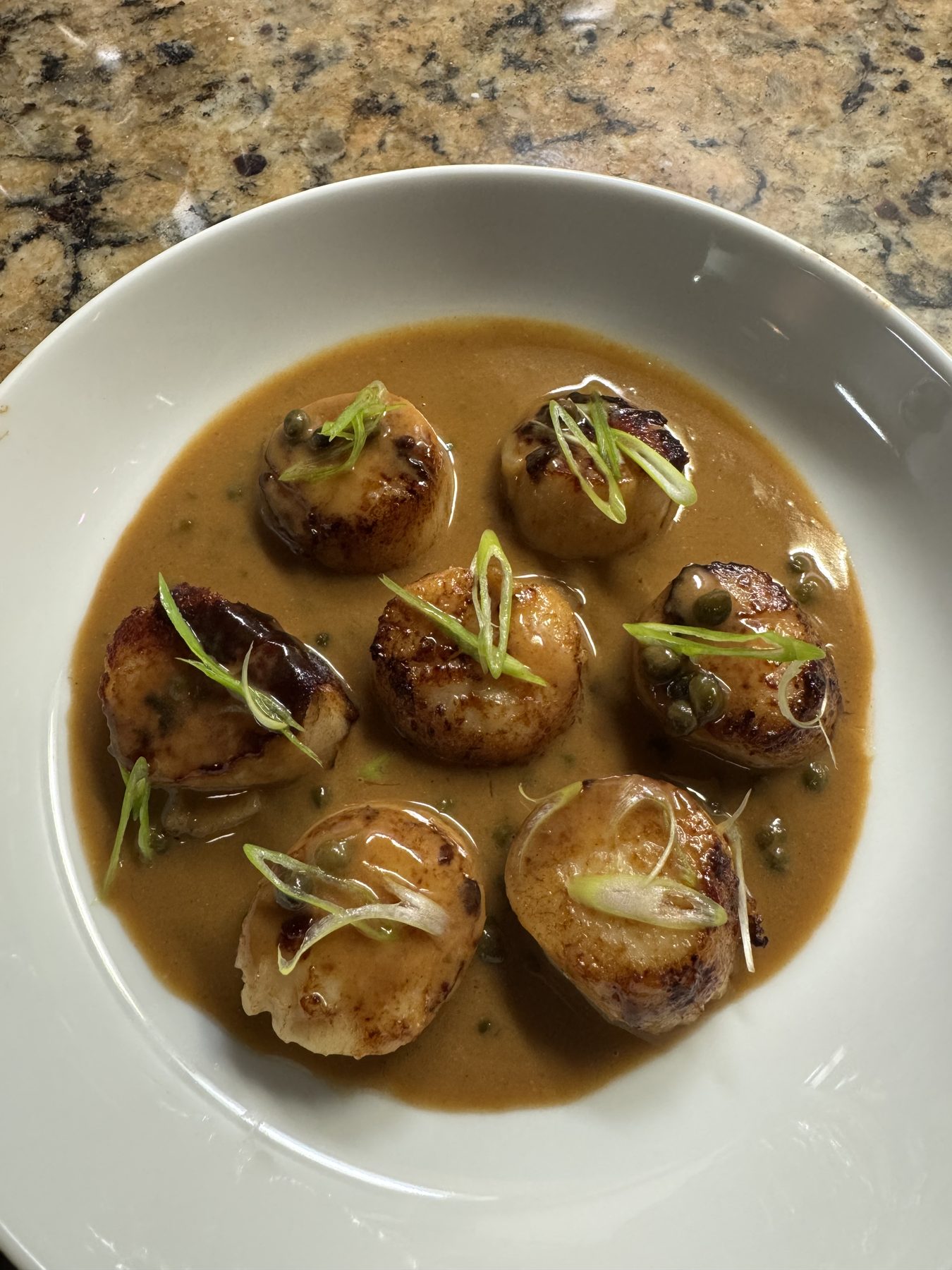 Seared scallops in brown butter caper sauce by Chef Andrew Oliver